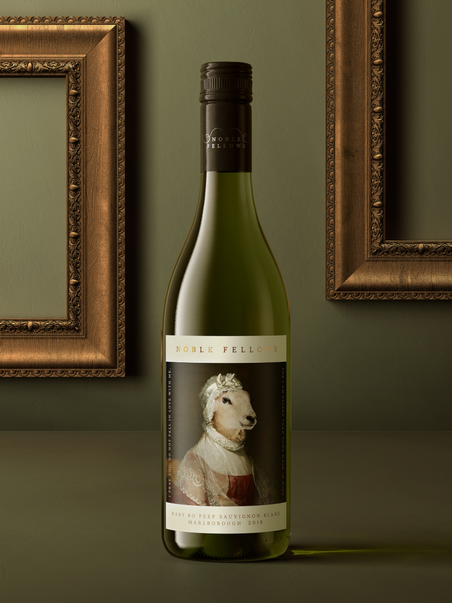 A bottle of Noble Fellows “Mary Bo Peep Sauvignon Blanc”, wine packaging design by Our Revolution in front of two embellished copper frames on a dark green wall Jen Doran