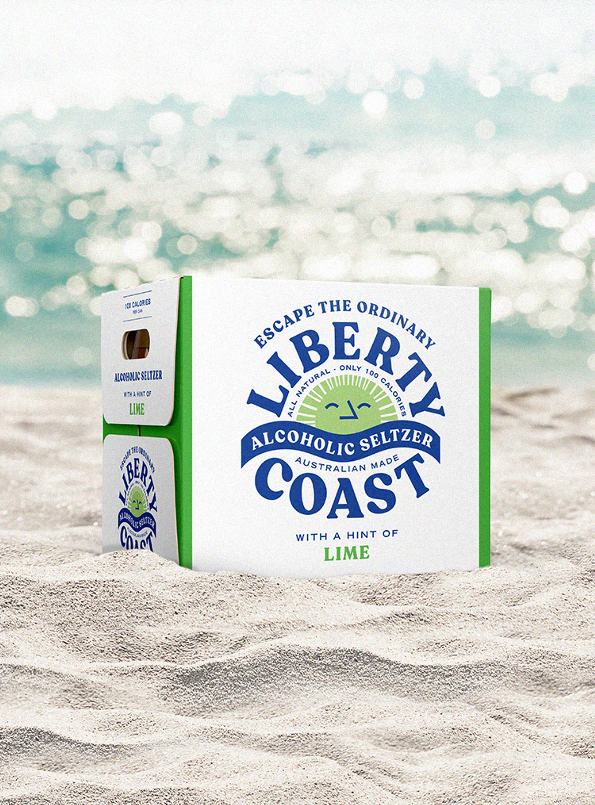 A box of Liberty Alcoholic Seltzer packaging design on a white sandy beach, by packaging design agency Our Revolution