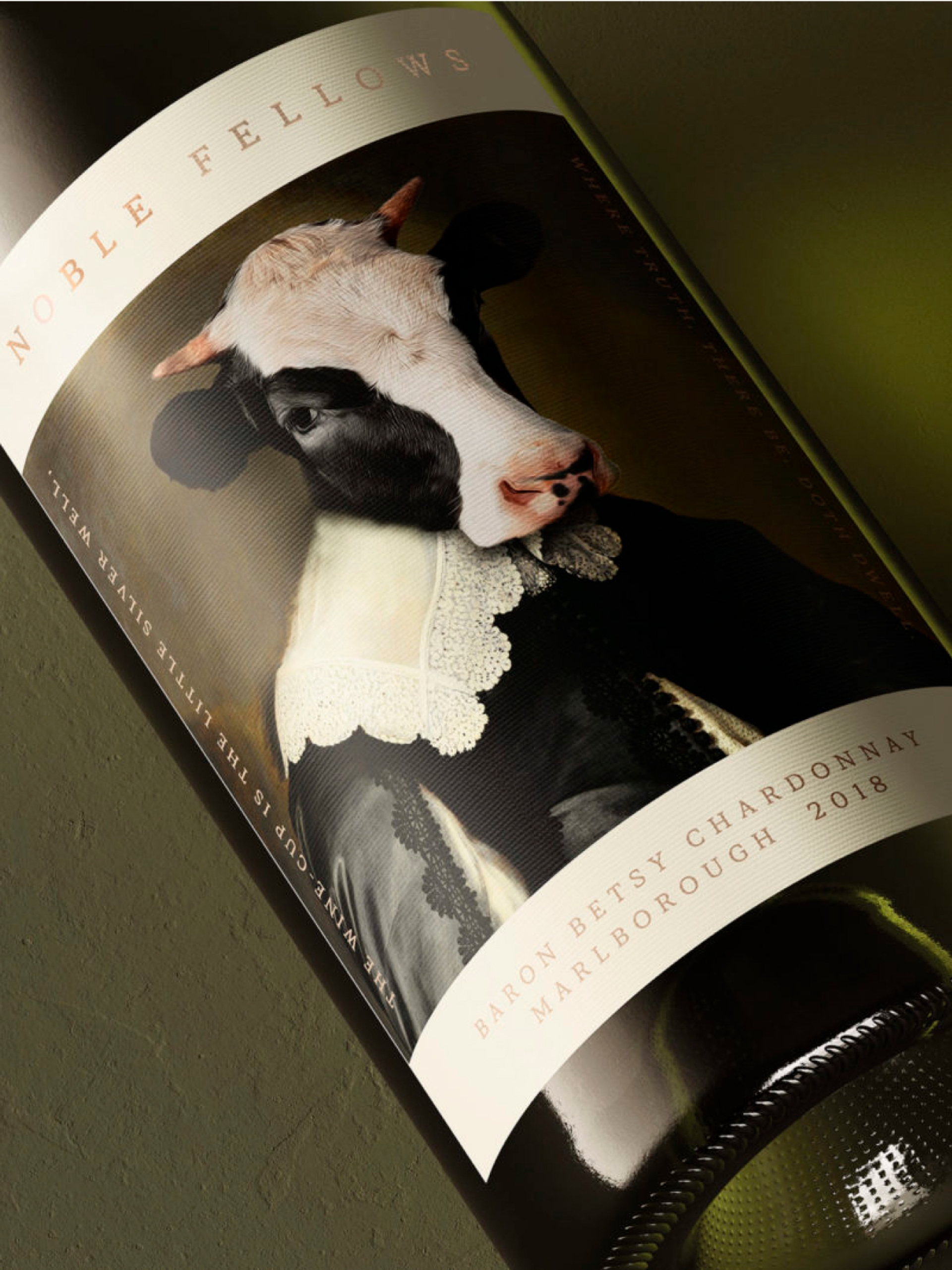 Close-up of wine label design for Noble Fellows “Baron Betsy Chardonnay Marlborough” by brand agency Our Revolution featuring a portrait of a cow wearing historical outfitting a renaissance portrait