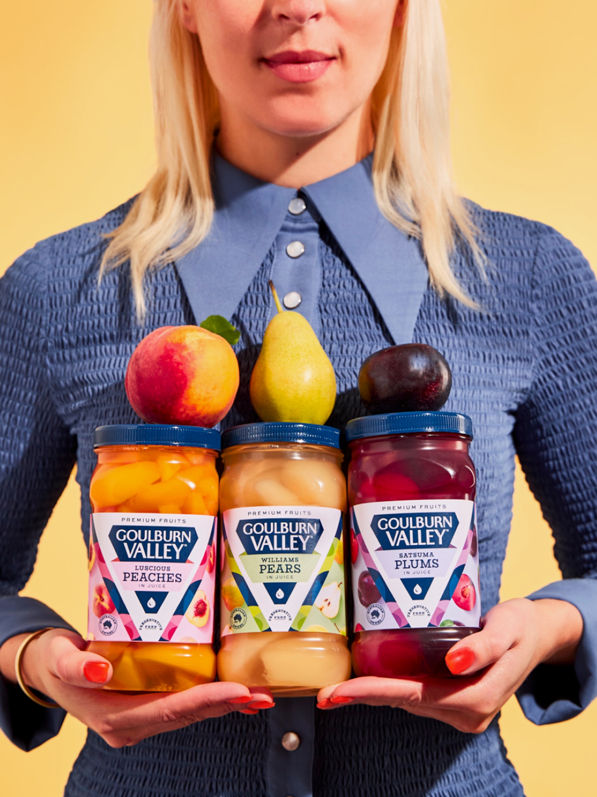 Woman holding packaging design of Goulburn Valley fruit brand designed by consumer brand agency Our Revolution in Sydney and London Jen Doran