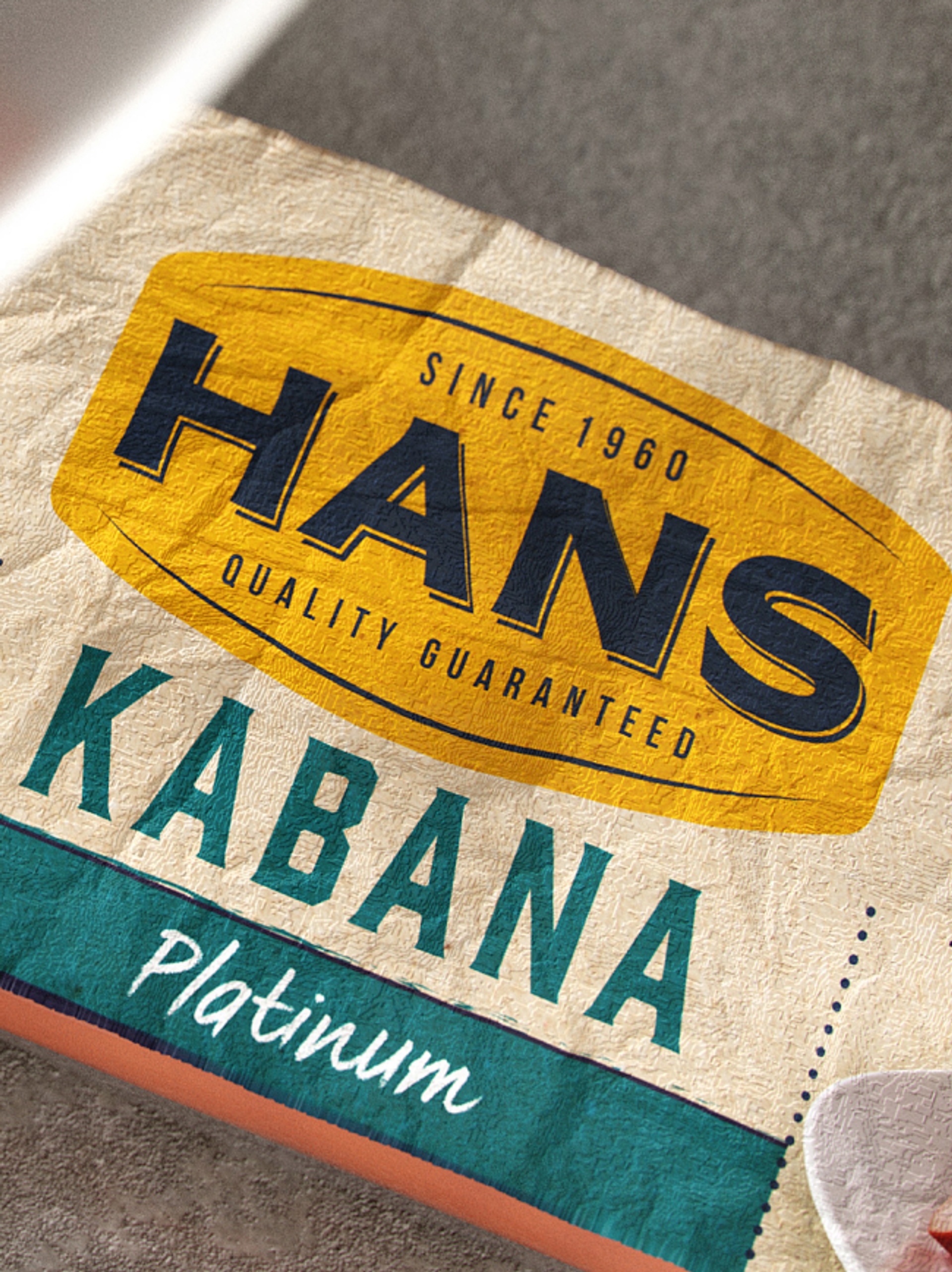 Close-up of textured packaging design for meat brand Hans Kabana Platinum, by packaging design agency Our Revolution