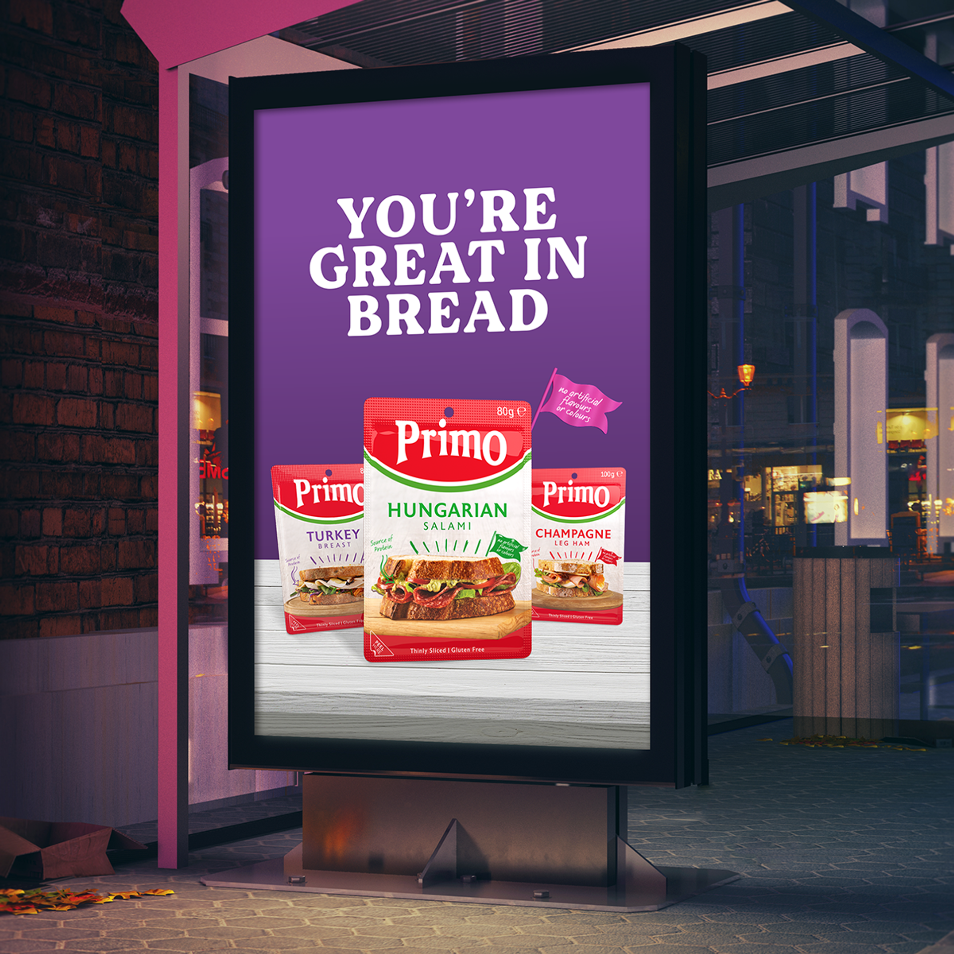 Night time bus shelter meat brand advert featuring Primo packaging design by Our Revolution for Primo’s Hungarian Salami, Turkey Breast, and Champagne Leg Ham, with slogan “You’re great in bread”