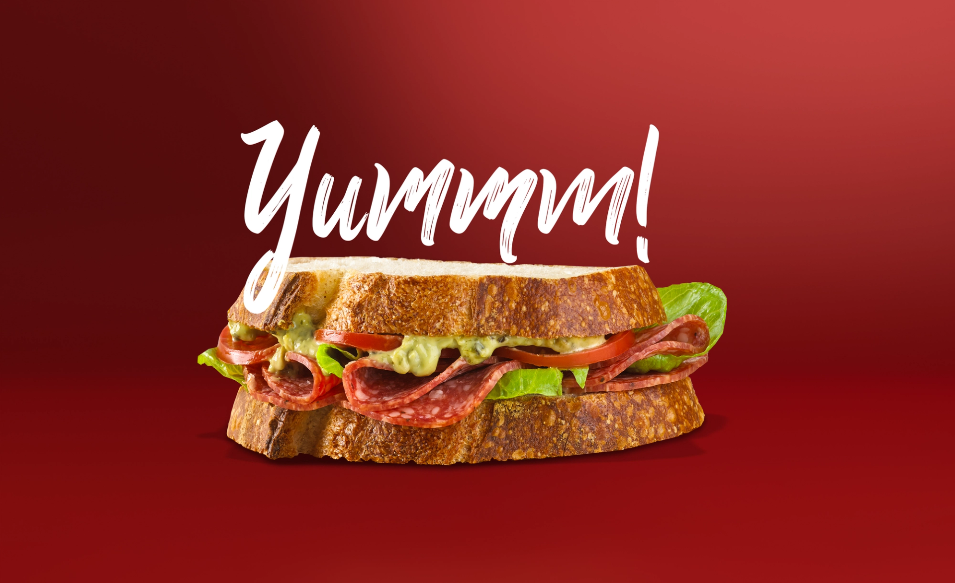 Primo meat brand design by Our Revolution with a salami sandwich with text “Yummm!”