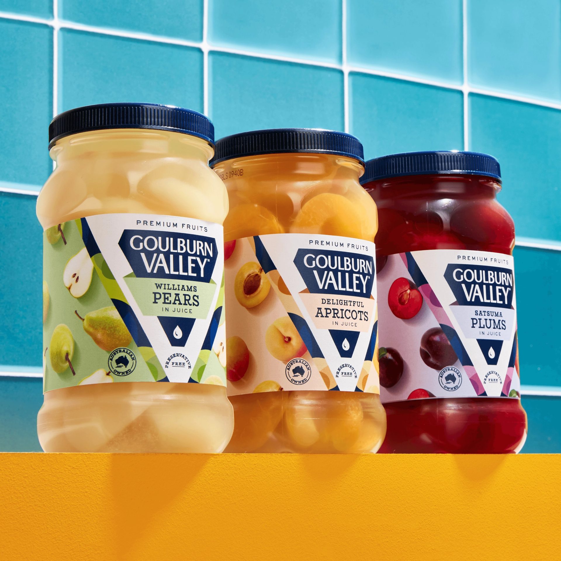 Goulburn Valley rebrand by packaging design agency Our Revolution showing three jars of preserved fruit in blue tiled kitchen Jen Doran